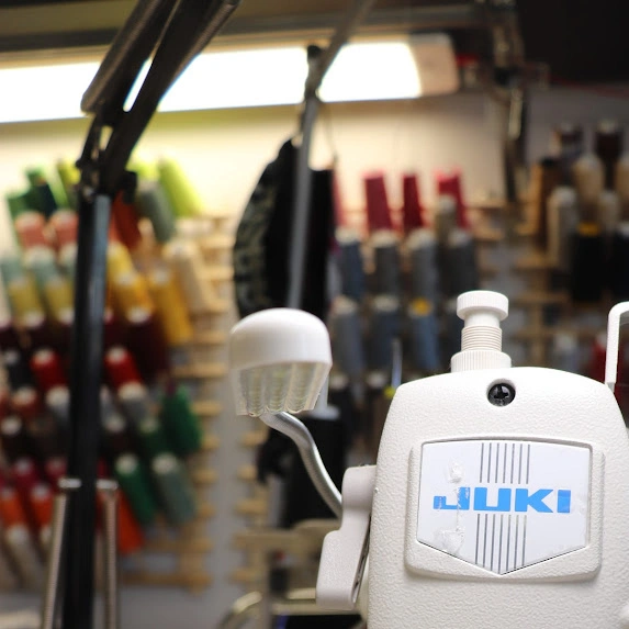 Juki sewing machine with thread spools for expert wedding dress alterations in Phoenix and Tucson